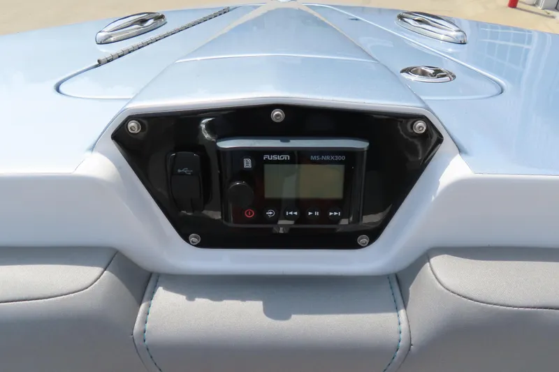 Slide: The Image of 2020 Sunsation 34 CCX boat dashboard with Fusion MS-NRX300 audio system. - 18