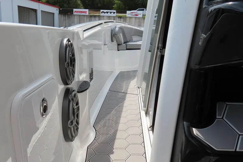 Slide: The Image of 2020 Sunsation 34 CCX boat interior with hexagonal flooring and speaker system. - 19