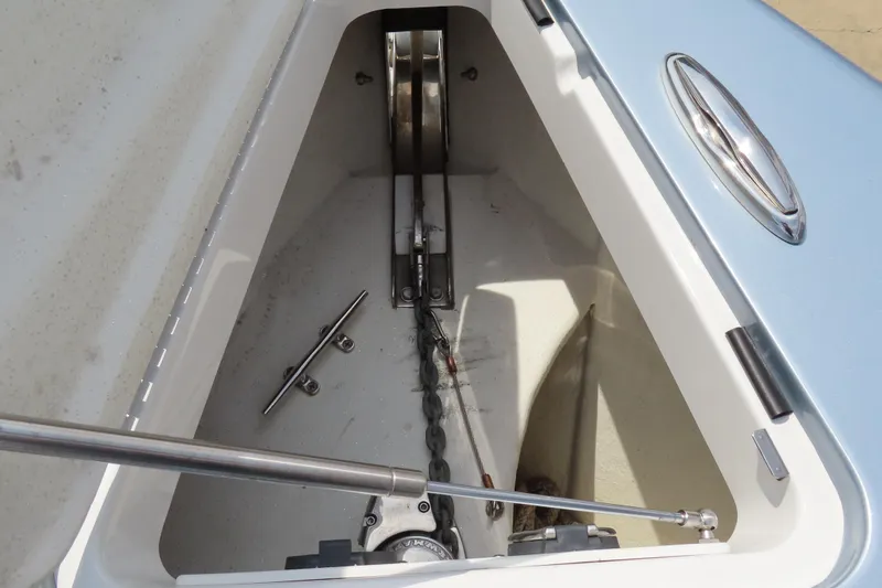Slide: The Image of Anchor compartment of 2020 Sunsation 34 CCX boat, featuring chain and cleat. - 20