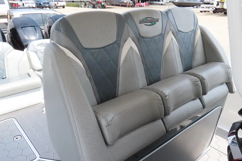 Slide: The Image of 2020 Sunsation 34 CCX boat seating with gray upholstery and diamond stitching. - 22