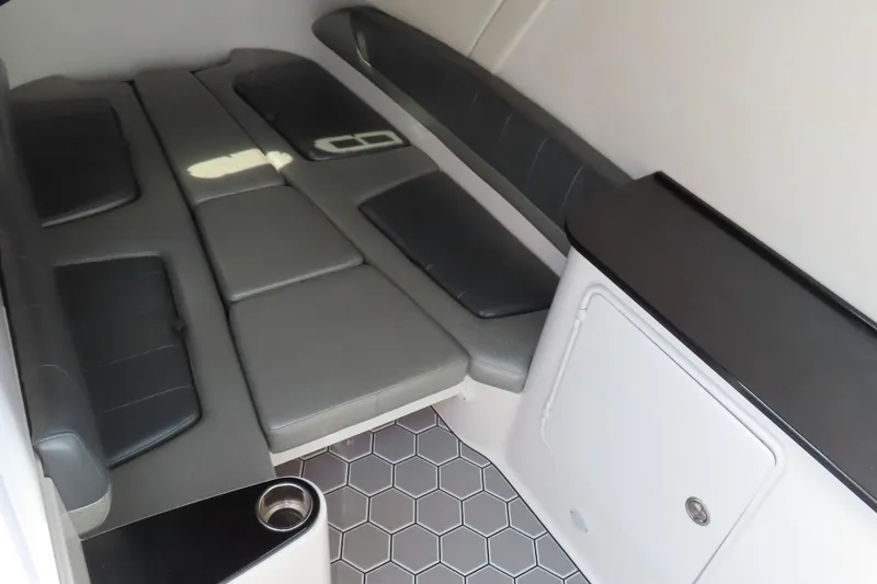 Slide: The Image of 2020 Sunsation 34 CCX cabin interior with gray seating and hexagonal flooring. - 24