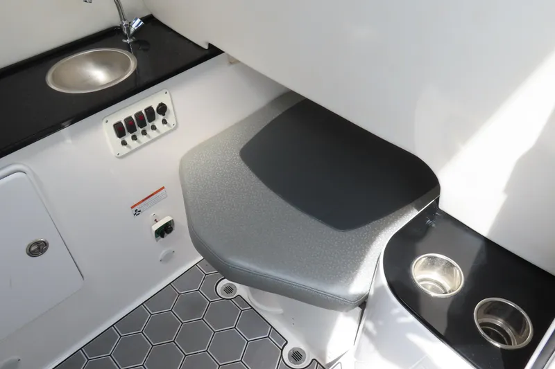 Slide: The Image of 2020 Sunsation 34 CCX interior with sink, seat, and cup holders. - 25