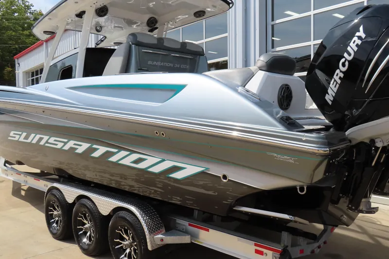 Slide: The Image of 2020 Sunsation 34 CCX boat on trailer with Mercury outboard engine. - 8