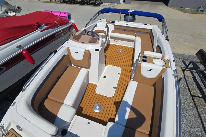 Slide: The Image of 2021 Starcraft SVX 191 OB boat with tan seating and wood-style flooring. - 15