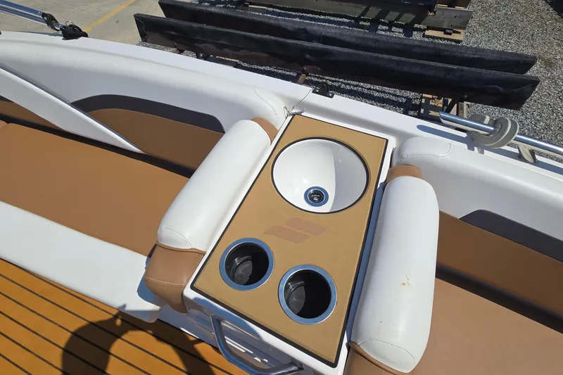 Slide: The Image of 2021 Starcraft SVX 191 OB boat interior with sink and cup holders. - 17