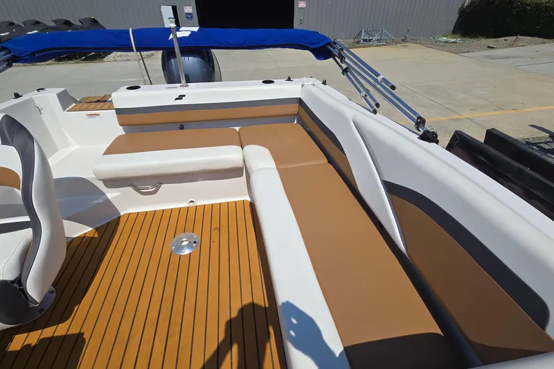 Slide: The Image of 2021 Starcraft SVX 191 OB boat interior with tan seating and wood-style flooring. - 18