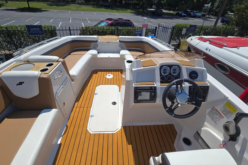 Slide: The Image of 2021 Starcraft SVX 191 OB boat interior with modern dashboard and seating. - 22