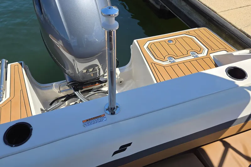 Slide: The Image of 2021 Starcraft SVX 191 OB boat with Yamaha 115 engine, docked with teak-style flooring. - 31