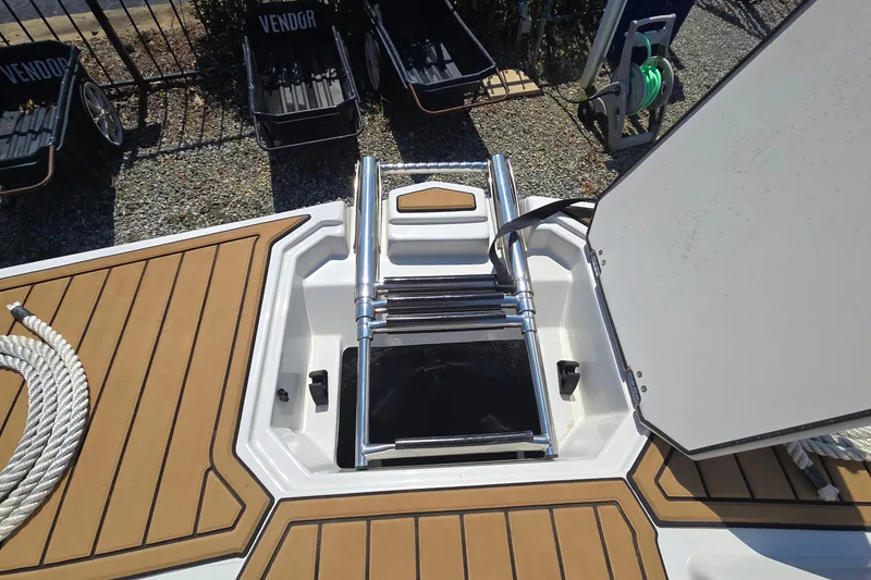 Slide: The Image of 2021 Starcraft SVX 191 OB boat with open hatch and ladder on deck. - 37