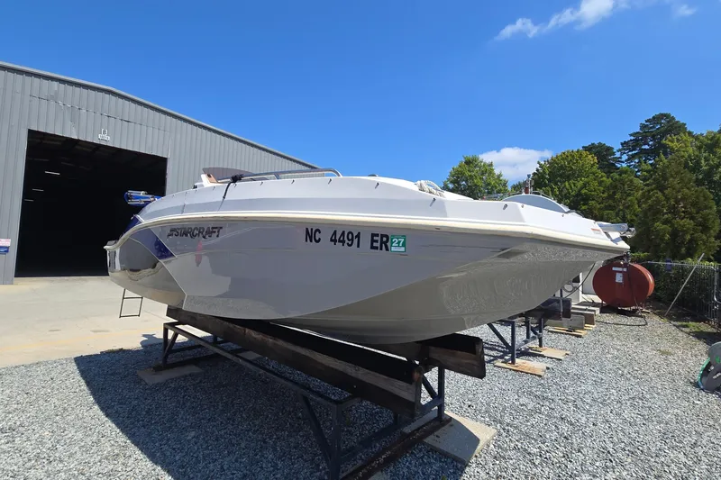 Slide: The Image of 2021 Starcraft SVX 191 OB boat on display outside a warehouse. - 4