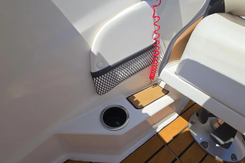 Slide: The Image of 2021 Starcraft SVX 191 OB boat interior with cup holder and netted storage. - 40