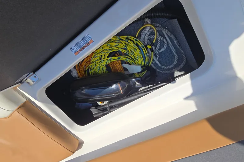 Slide: The Image of Storage compartment in a 2021 Starcraft SVX 191 OB boat with ropes and equipment. - 41