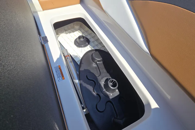 Slide: The Image of Storage compartment in 2021 Starcraft SVX 191 OB boat, featuring secure latches and durable materials. - 43