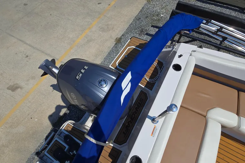 Slide: The Image of 2021 Starcraft SVX 191 OB boat with Yamaha outboard motor, blue cover, and tan seating. - 45