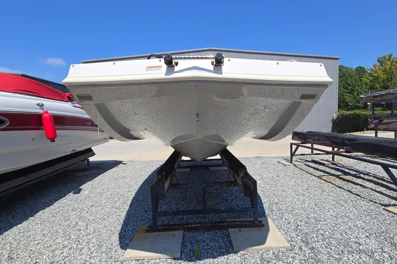 Slide: The Image of 2021 Starcraft SVX 191 OB boat on trailer, displayed outdoors on gravel. - 5