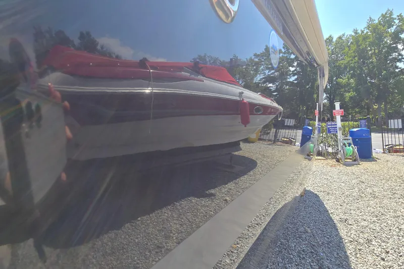 Slide: The Image of 2021 Starcraft SVX 191 OB boat reflected on a shiny surface, outdoor setting. - 8