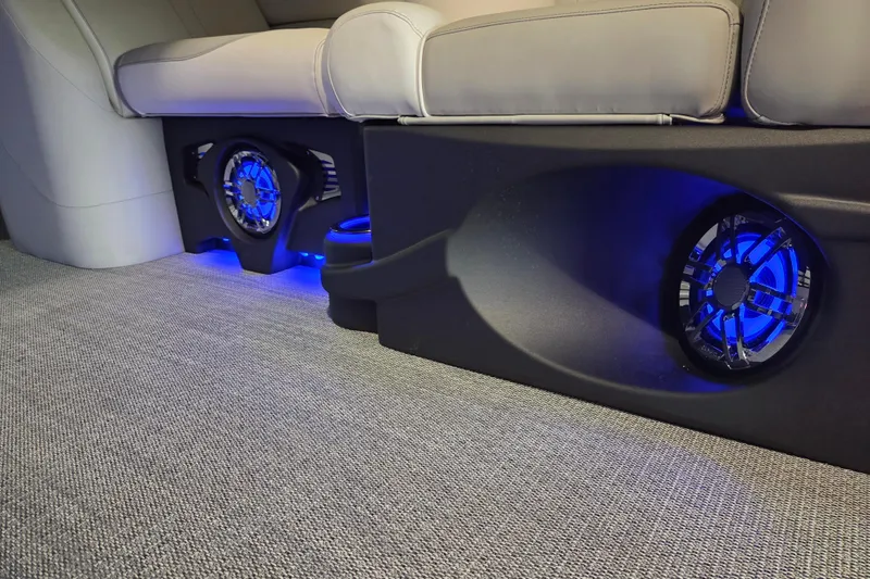 Slide: The Image of 2026 Avalon Platinum LSZ 2385 Entertainer interior with illuminated speakers and plush seating. - 15