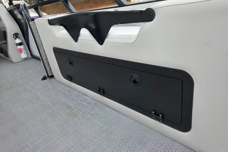 Slide: The Image of 2026 Avalon Platinum LSZ 2385 Entertainer interior storage compartment with sleek design. - 16