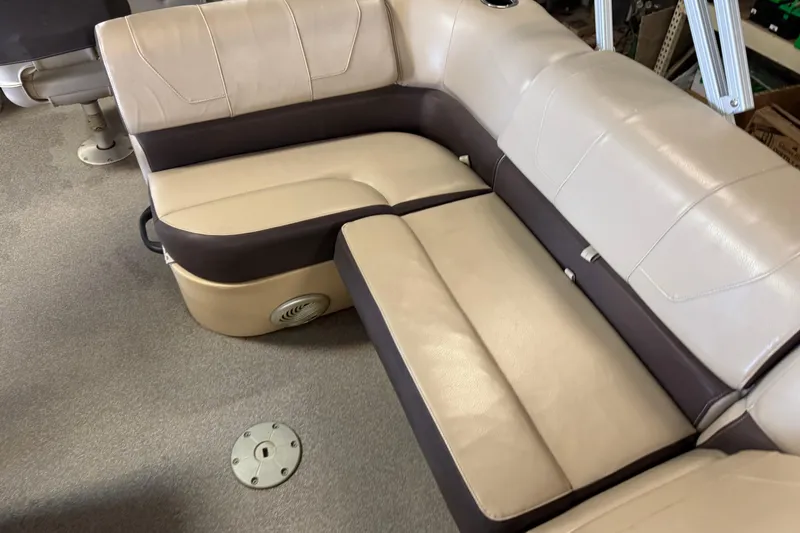 Slide: The Image of 2018 Sun Tracker SportFish 22 XP3 boat seating, beige and brown upholstery, spacious and comfortable design. - 11