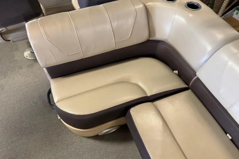 Slide: The Image of 2018 Sun Tracker SportFish 22 XP3 boat seating with beige and brown upholstery. - 13