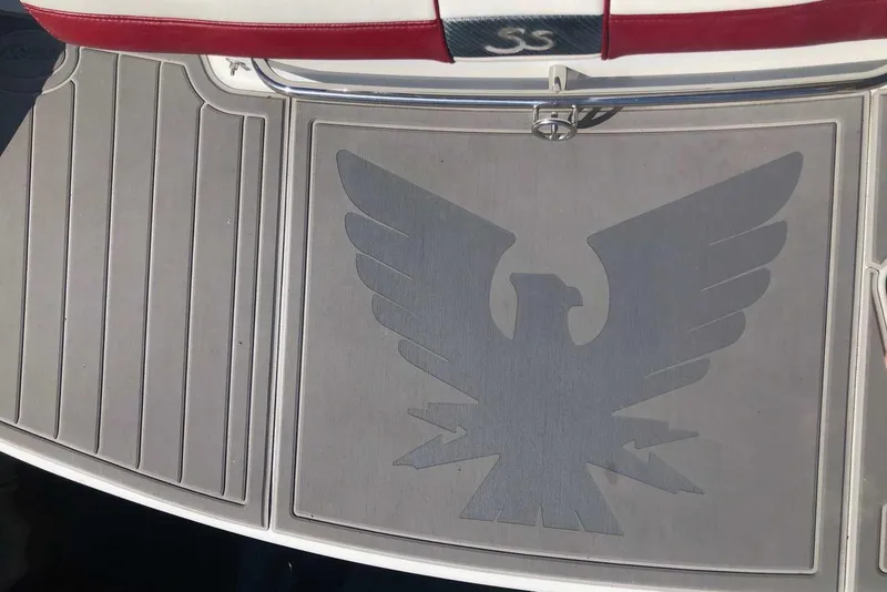 Slide: The Image of 2012 Formula 310 Sun Sport boat deck with eagle emblem and red accents. - 10