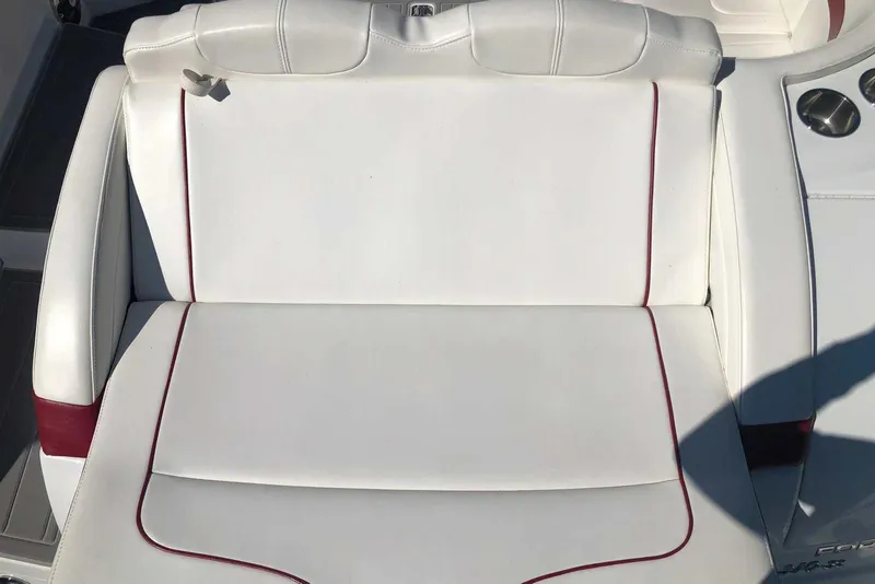 Slide: The Image of White leather seat on 2012 Formula 310 Sun Sport boat with red accents. - 11