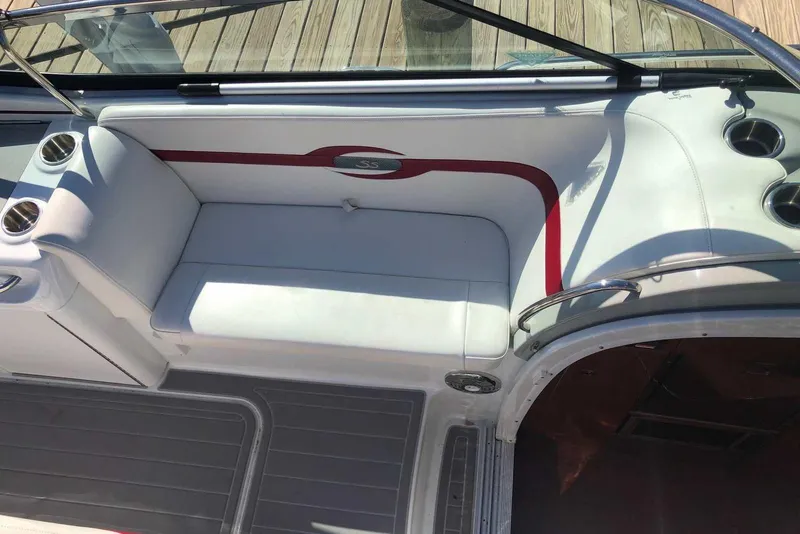 Slide: The Image of 2012 Formula 310 Sun Sport boat interior with white seating and red accents. - 16