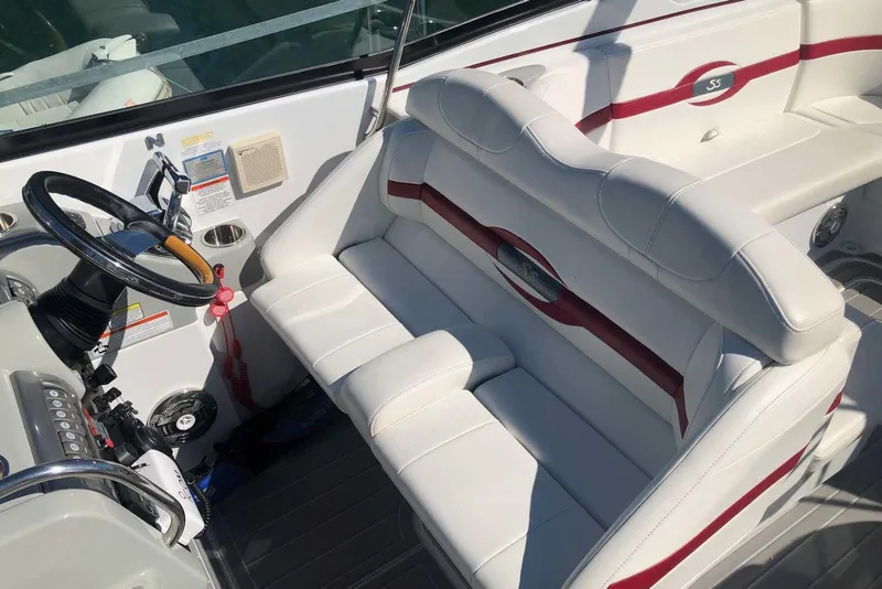 Slide: The Image of 2012 Formula 310 Sun Sport boat interior with white and red seating. - 17