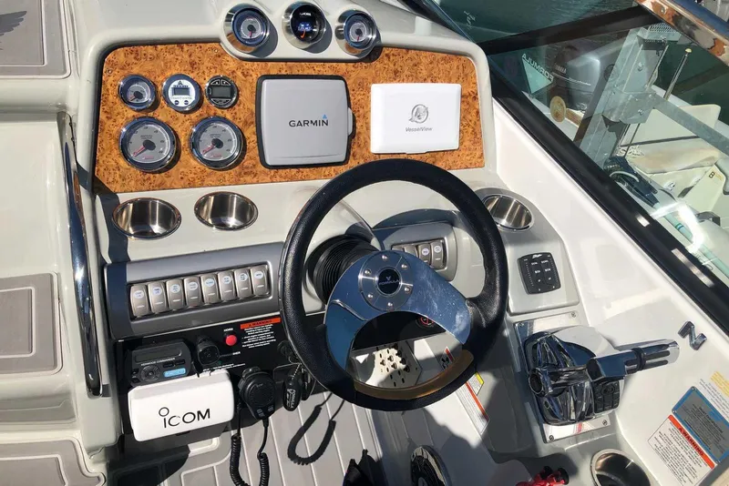 Slide: The Image of 2012 Formula 310 Sun Sport dashboard with Garmin navigation and ICOM communication systems. - 18