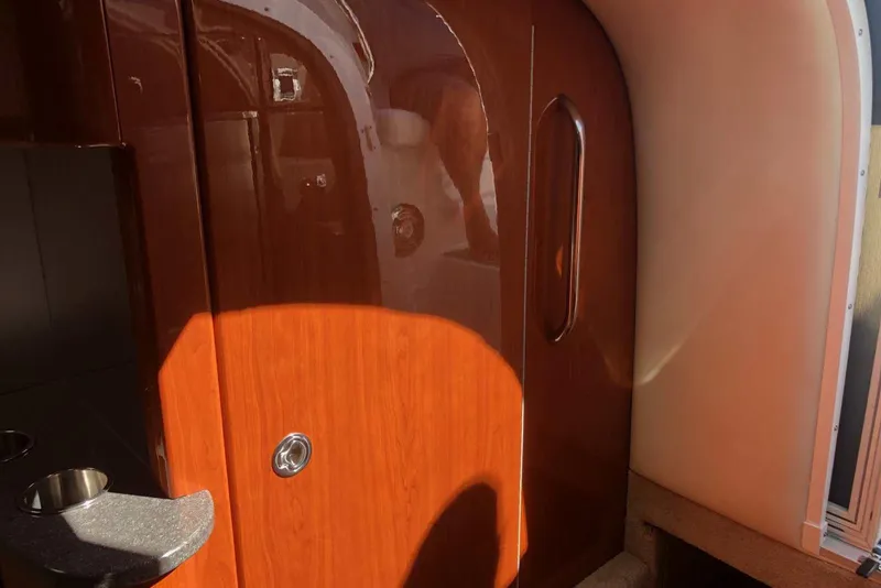 Slide: The Image of Interior of 2012 Formula 310 Sun Sport boat with wooden cabinetry and sleek design. - 31