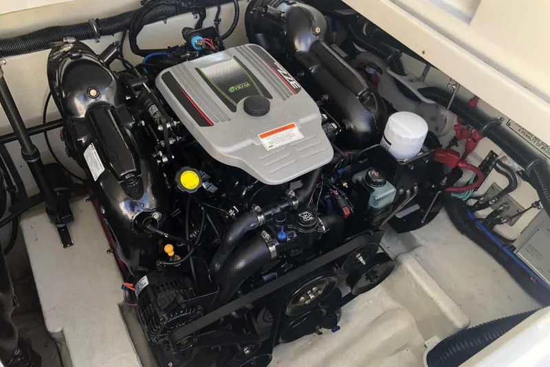 Slide: The Image of Engine compartment of a 2012 Formula 310 Sun Sport boat, showcasing detailed components. - 37