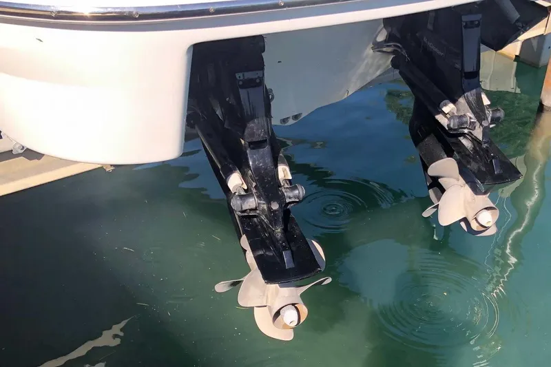 Slide: The Image of 2012 Formula 310 Sun Sport boat propellers in clear water. - 6