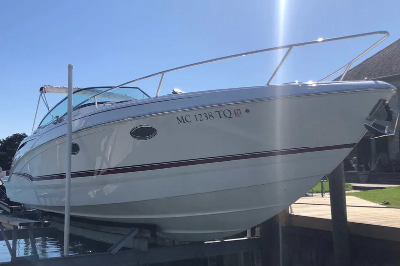 Slide: The Image of 2012 Formula 310 Sun Sport boat docked under clear blue sky. - 8
