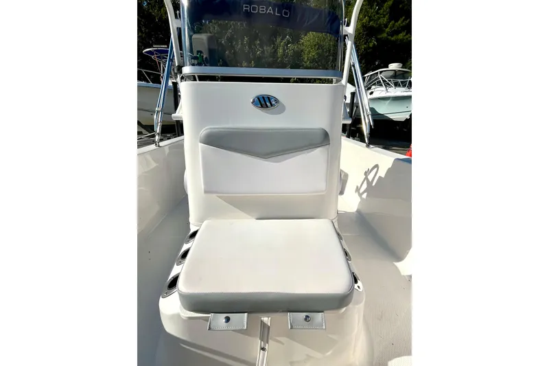 Slide: The Image of 2021 Robalo R160 Center Console boat seat with sleek white design. - 12