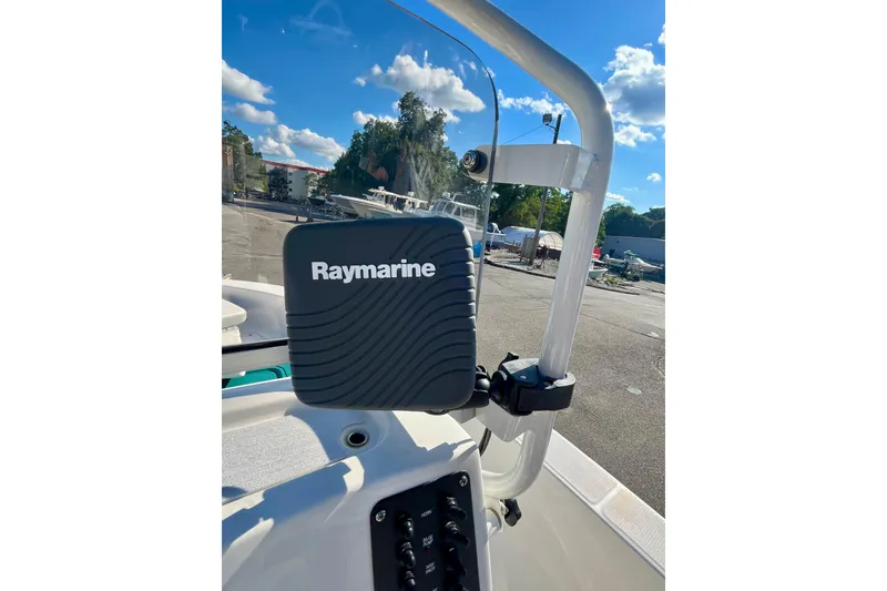 Slide: The Image of Raymarine device on 2021 Robalo R160 Center Console boat, clear sky background. - 13