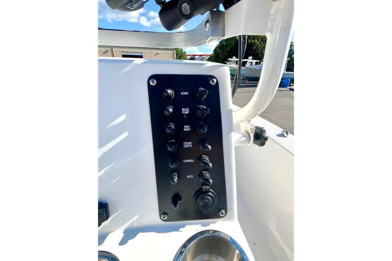 Slide: The Image of Control panel of 2021 Robalo R160 Center Console boat with labeled switches. - 14