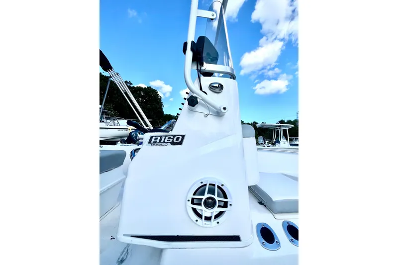 Slide: The Image of 2021 Robalo R160 Center Console boat with clear blue sky background. - 4