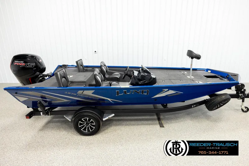 The Image of 2026 Lund 1875 Renegade fishing boat, blue exterior, on trailer, with Mercury Pro XS engine. - 1