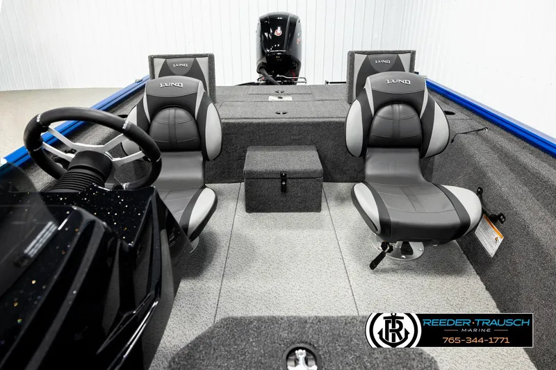 Slide: The Image of 2026 Lund 1875 Renegade boat interior with two seats and steering wheel. - 15