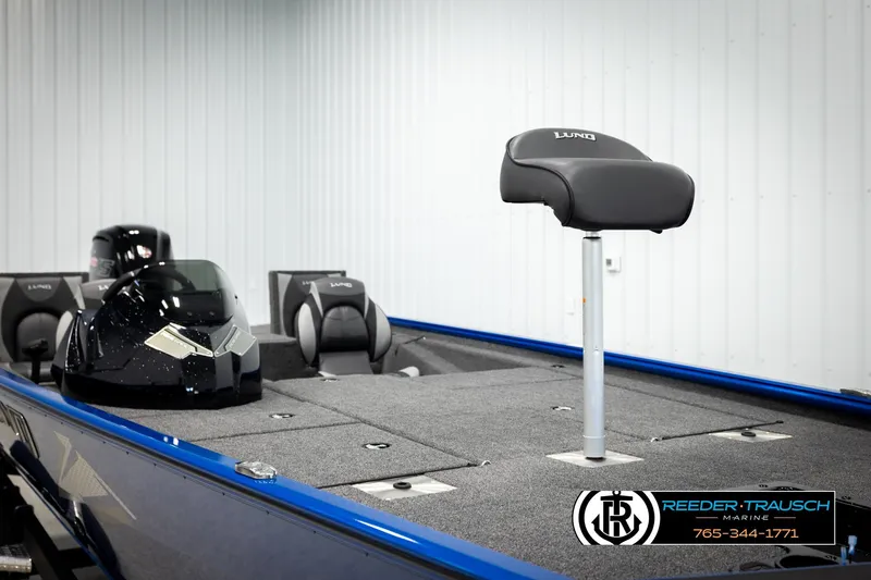 Slide: The Image of 2026 Lund 1875 Renegade boat interior with seating and console, showcased at Reeder-Trausch Marine. - 26