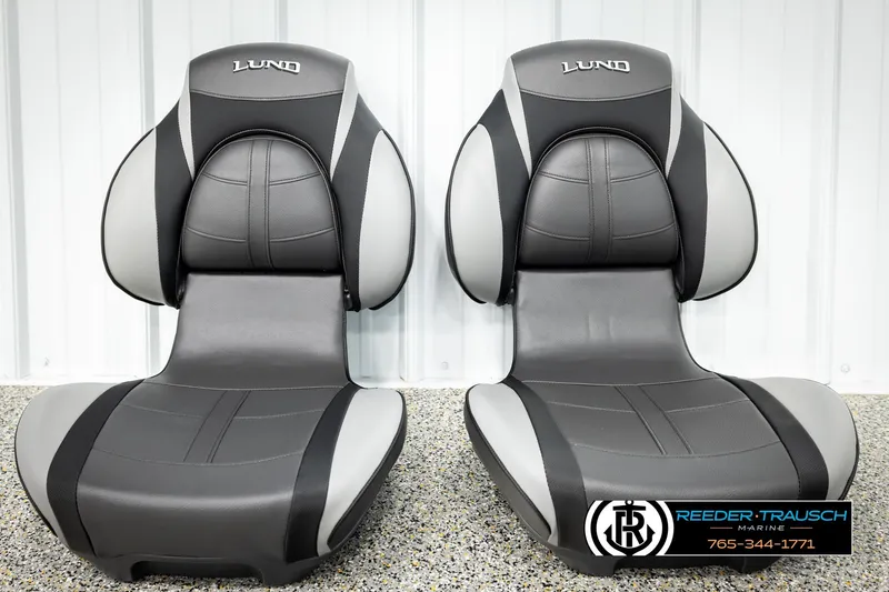 Slide: The Image of 2026 Lund 1875 Renegade boat seats, black and gray, displayed indoors. - 35