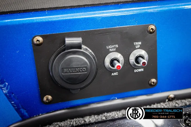 Slide: The Image of Control panel of 2026 Lund 1875 Renegade boat with switches and Marinco socket. - 37