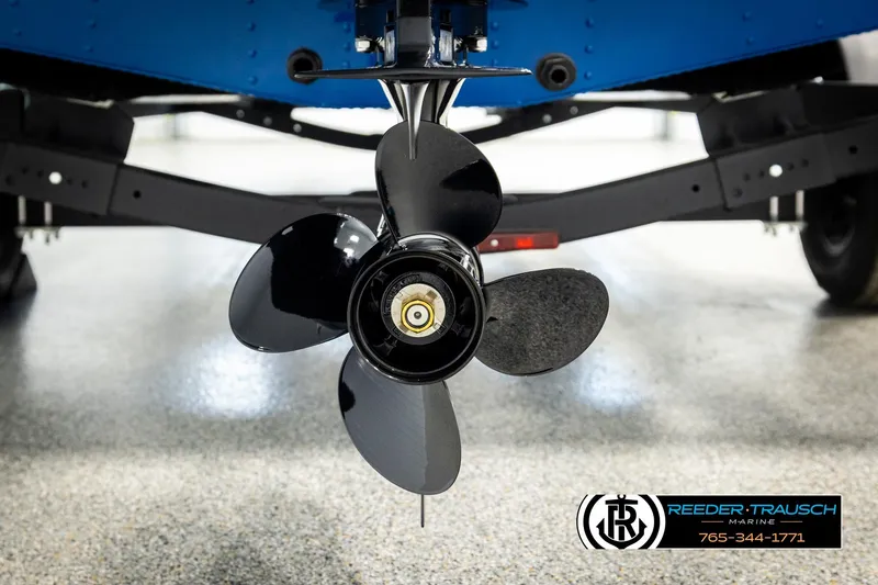 Slide: The Image of 2026 Lund 1875 Renegade boat propeller, close-up view in a showroom setting. - 43