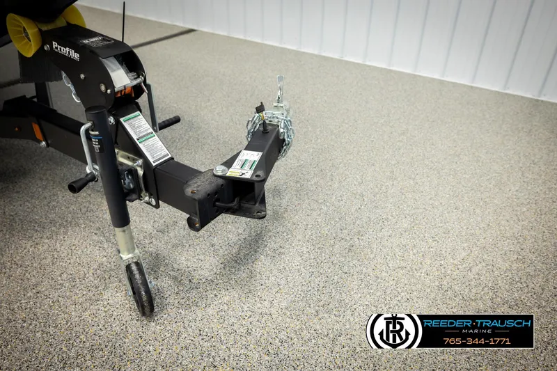 Slide: The Image of Trailer hitch of 2026 Lund 1875 Renegade boat on showroom floor. - 45