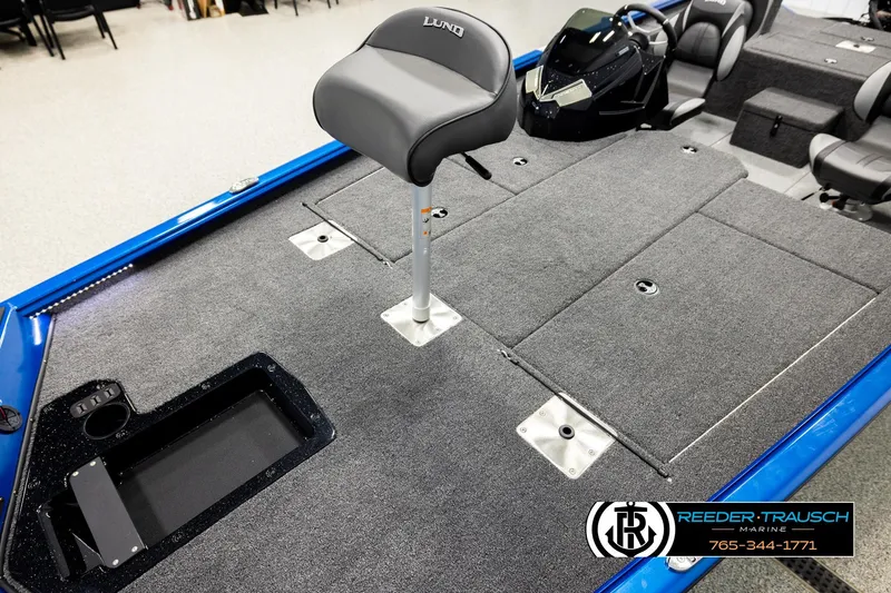 Slide: The Image of 2026 Lund 1875 Renegade boat interior with gray carpet and seating, Reeder-Trausch Marine. - 8