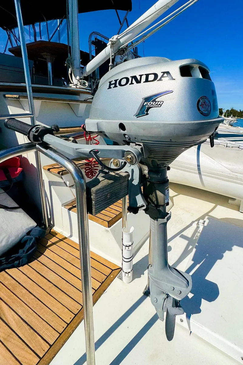 Slide: The Image of Honda outboard motor on 1988 Grand Banks 42 Classic yacht deck. - 12