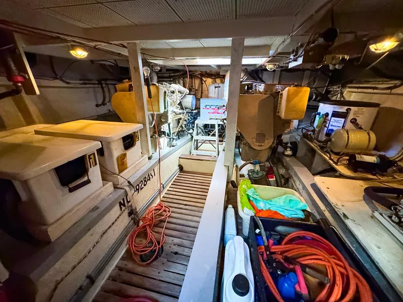 Slide: The Image of Engine room of 1988 Grand Banks 42 Classic yacht with equipment and storage. - 32