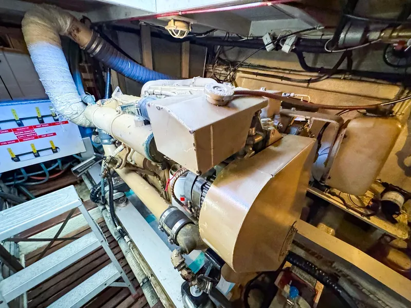 Slide: The Image of Engine room of 1988 Grand Banks 42 Classic yacht, showcasing mechanical components. - 33