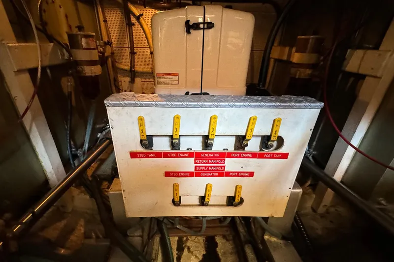 Slide: The Image of Engine room of 1988 Grand Banks 42 Classic with labeled control panel. - 35