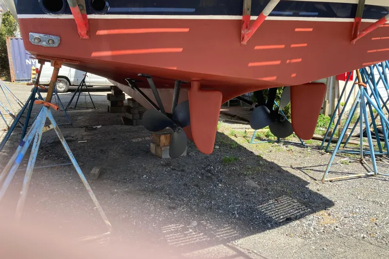 Slide: The Image of Grand Banks 42 Classic 1988 boat hull and propellers on dry dock. - 36
